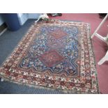 Middle Eastern Wool Rug, with three central diamond motifs on blue ground, all-over floral and