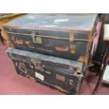 Two XIX Century Black Hessian Travel Trunks, with leather handles (damages).