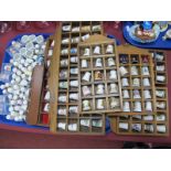 Pottery Thimbles - A large quantity with nine wooden display racks.