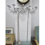 Pair of White Metal Eight Branch Candelabra on Stands, 102cm high; a similar single stick. (3)
