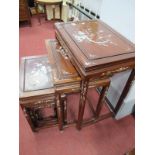 A Nest of Four Chinese Hardwood Chrome Tables, with allover mother of pearl inlay as foliage.