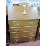 Oak Bureau, with fall front over four drawers, on bracket feet, 75cm wide.