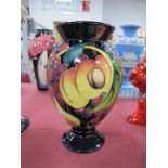 A Moorcroft Pottery Vase, painted in the 'Queens Choice' design by Emma Bossons, impressed and