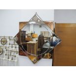 An Art Deco Eight Pointed Wall Mirror, with flower head decoration and pin tinted surround, 70cm