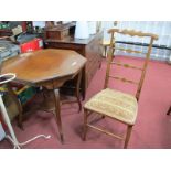 Edwardian Inlaid Mahogany Window Table, having octagonal top and undershelf united by sabre legs,