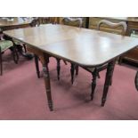 A XIX Century Mahogany Pembrooke Table, having rounded corners to drop leaves, on turned legs 136