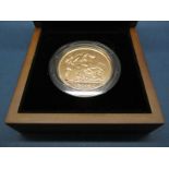 The Royal Mint 2009 UK Five Pounds Gold Brilliant Uncirculated Sovereign, certified No.0127, cased.