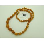 A Single Strand Graduated Amber Coloured Bead Necklace, (overall weight 29 grams).
