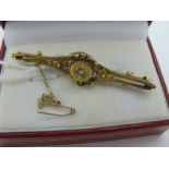 A Victorian Bar Brooch, star set centre highlight, within decorative openwork border (3.5 grams).