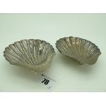 A Matched Pair of Hallmarked Silver Shell Dishes, HA, Sheffield 1908, 1910, each raised on three