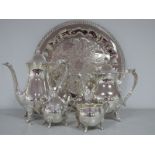 A Modern Silver Plated Four Piece Tea Set, together with a decorative circular tray. (5)