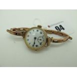 A 9ct Gold Cased Ladies Wristwatch, the white dial with black and red Roman numerals, within