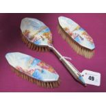 A Highly Decorative Enamel Backed Three Piece Brush Set, each detailed with river scape scene,