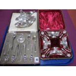 A Decorative Set of Four Plated Salts, complete with spoons, in original fitted case; a cased set of