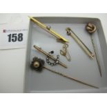 A Single Stone Diamond Set Bar Brooch, claw set on plain bar, together with two stick pins, a