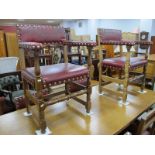 A Set of Six (Four Single , Two Carvers) Oak Dining Chairs, with studded claret leatherette seats