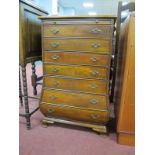 A Small Mahogany Bombe Style Chest, with seven drawers on bracket feet, 44.5 cm wide.