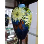 Burmantofts Faience Pottery Vase, of ovoid form, decorated with foliage and flowers on blue