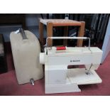 Singer and Necchi Sewing Machines (cased); plus a small wooden stool. (3)