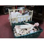 A Quantity of Dolls and Doll Body Parts, in Cot and Box.