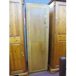 A Light Oak Hall Wardrobe, having ironing board to deep door, 53cm wide,