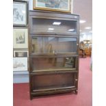 Gunn Four Sectional Glazed Bookcase, having lift-up doors, on four footed base, 87cm wide.