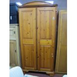 A Pine Two Door Wardrobe, having arched top and canted corners, 100 cm wide.