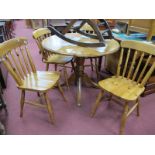 A Pine Circular Topped Kitchen Table and four farmhouse style chairs. (5)