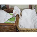 A Quantity of White Damask and Other White Linens, in two wicker boxes.