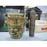 A XIX Century Brass Vase, having twin rams head handles, and cherubs to body (base absent), 20 cm