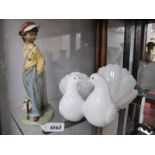 Lladro Figure of Youth Sporting Cap, stamped 2271 21.5cm high, and Lladro twin doves. (2)
