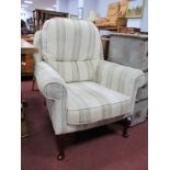 An Easy Chair, having cream striped fabric.