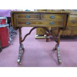 A Mahogany Sofa Style Table, having fall flaps, two short and one long drawer, on vase supports