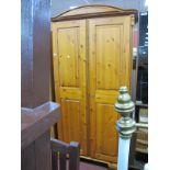 A Pine Two Door Wardrobe, having arched top and canted corners 100 cm wide.