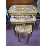 A Nest of Three Italian Coffee Tables, with canted corners and floral decoration.