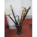 Walking Sticks in Umbrella Style Stick Stand, comprising of eight sticks, one with inset