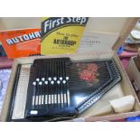An Autoharp, in original box with three music booklets.