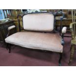 Early XX Century Mahogany Two Seater Salon Settee, with carved ribbon back, upholstered oval back