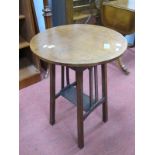 An Edwardian Inlaid Mahogany Occasional Table, with circular top, slatted supports, united by