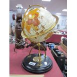 A Terrestrial Globe, on circular base having compass to centre, 29.5cm high overall.