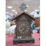 German Cuckoo Clock, with eight-day movement, in Gothic style arched case, 43cm high.