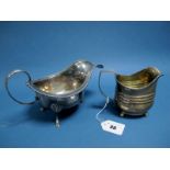 A Hallmarked Silver Jug, (markers mark indistinct) London 1830, with ribbed body, reeded edge and