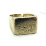 An 18ct Gold Gent's Ring, of textured finish, London 1967 (approximate finger size N/O).