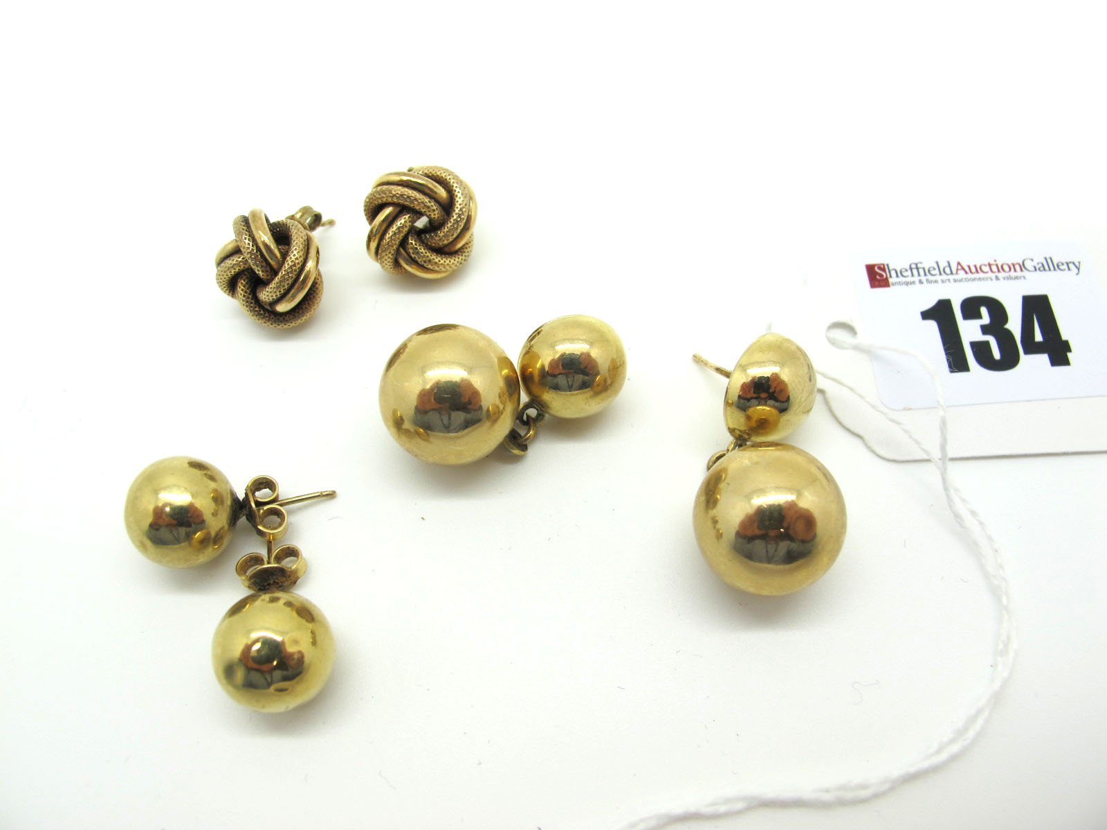 A Pair of 9ct Gold Ball Drop Earrings, together with a pair of large plain ball stud earrings; and a