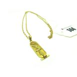 An Egyptian Cartouche Pendant, (indistinctly stamped) on a 9ct gold chain (23").
