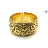 A Wide 18ct Gold Patterned Band, of foliate design (finger size P) (11grams).