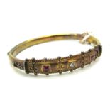 A 15ct Gold Diamond Set Bangle, with inset highlights, hinged to snap clasp, Birmingham 1904 (