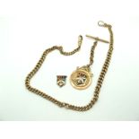 A 9ct Gold Graduated Curb Link Double Albert Chain, to double swivel style clasps, suspending T-