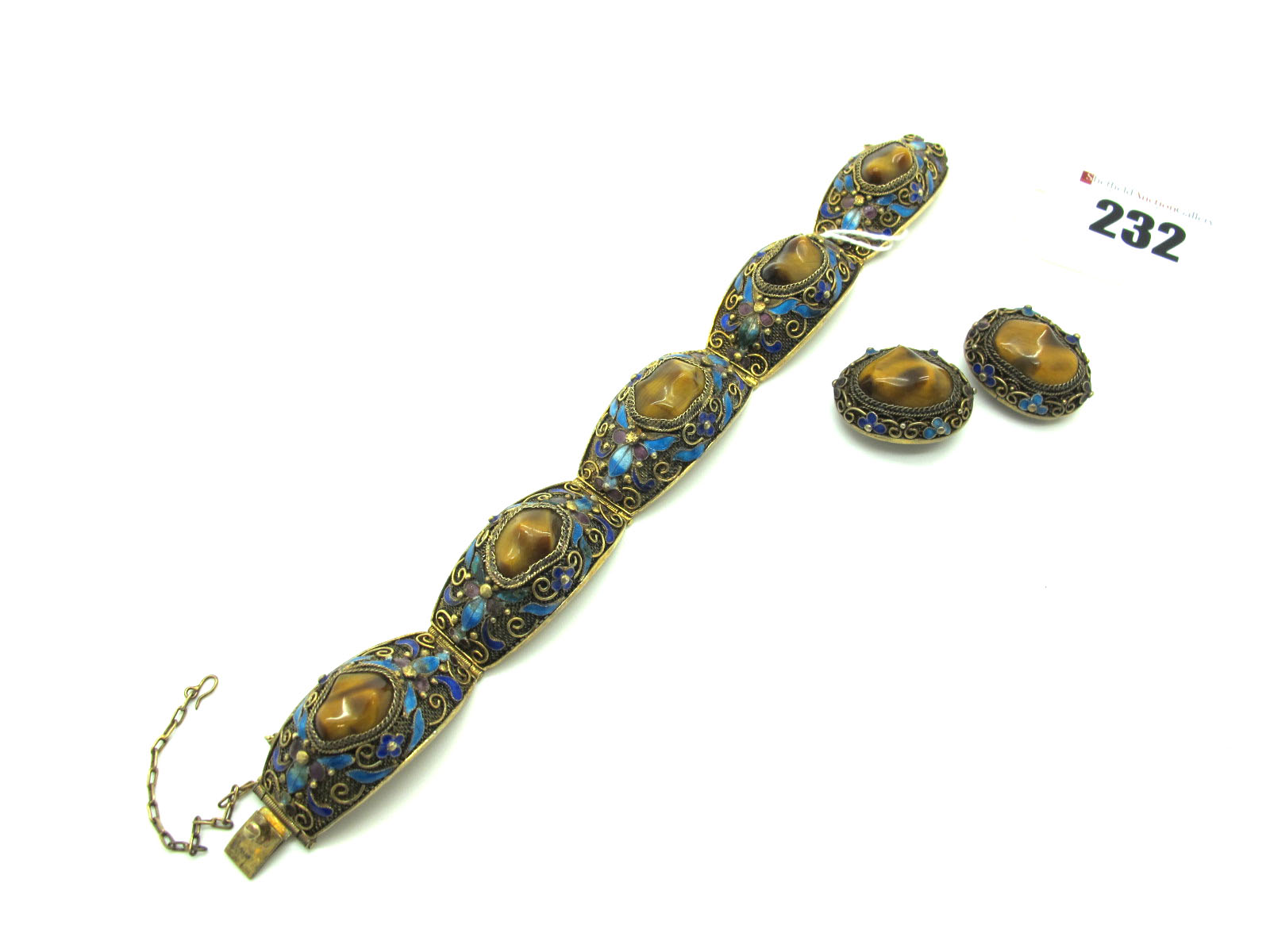 A Highly Decorative Tiger's Eye and Enamel Bracelet, composed of five high domed gilt filigree