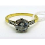 A Large Single Stone Diamond Ring, the (7mm) brilliant cut stone eight claw set, between textured